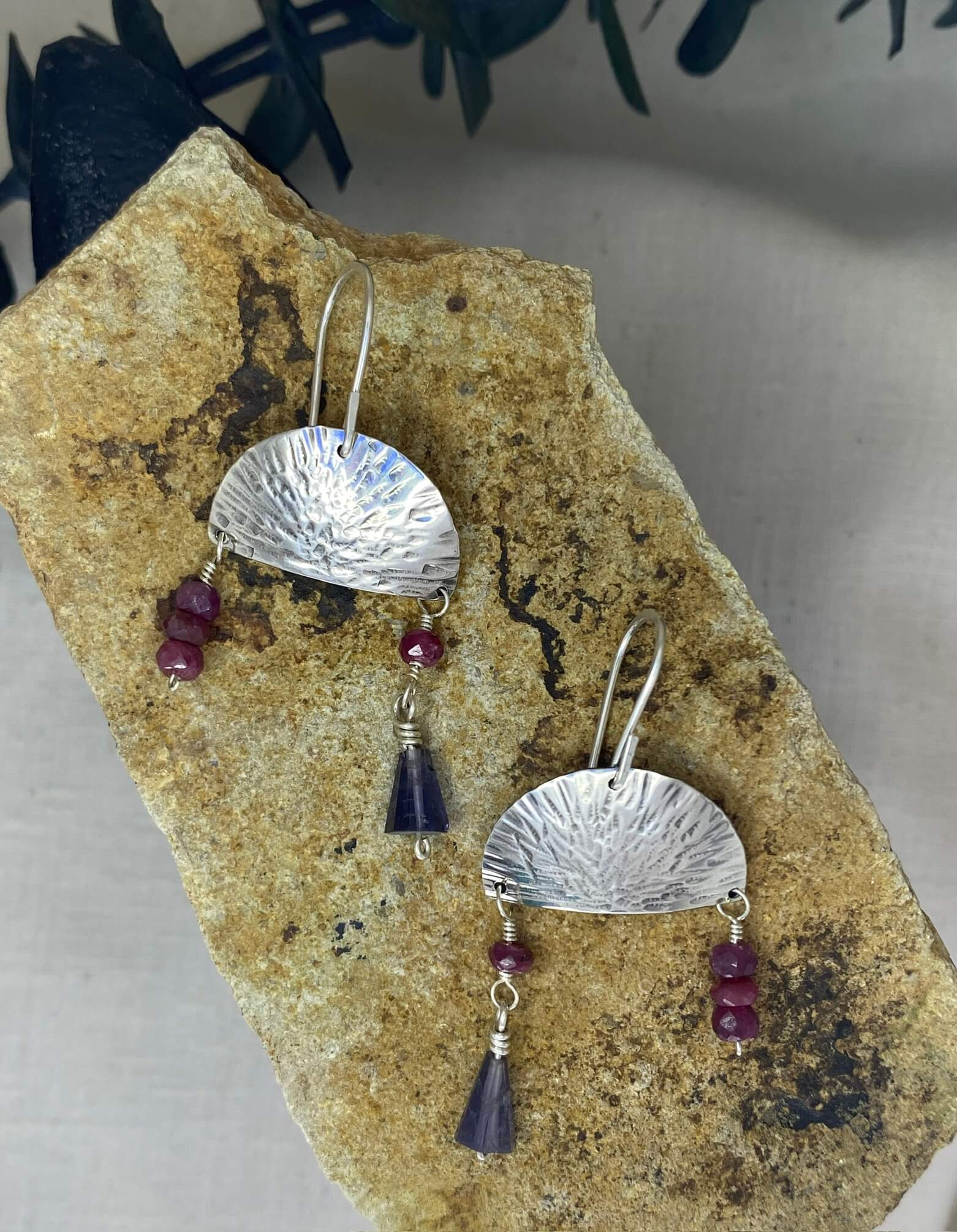 Hammered sterling silver half moon disc with ruby and iolite beads_top view