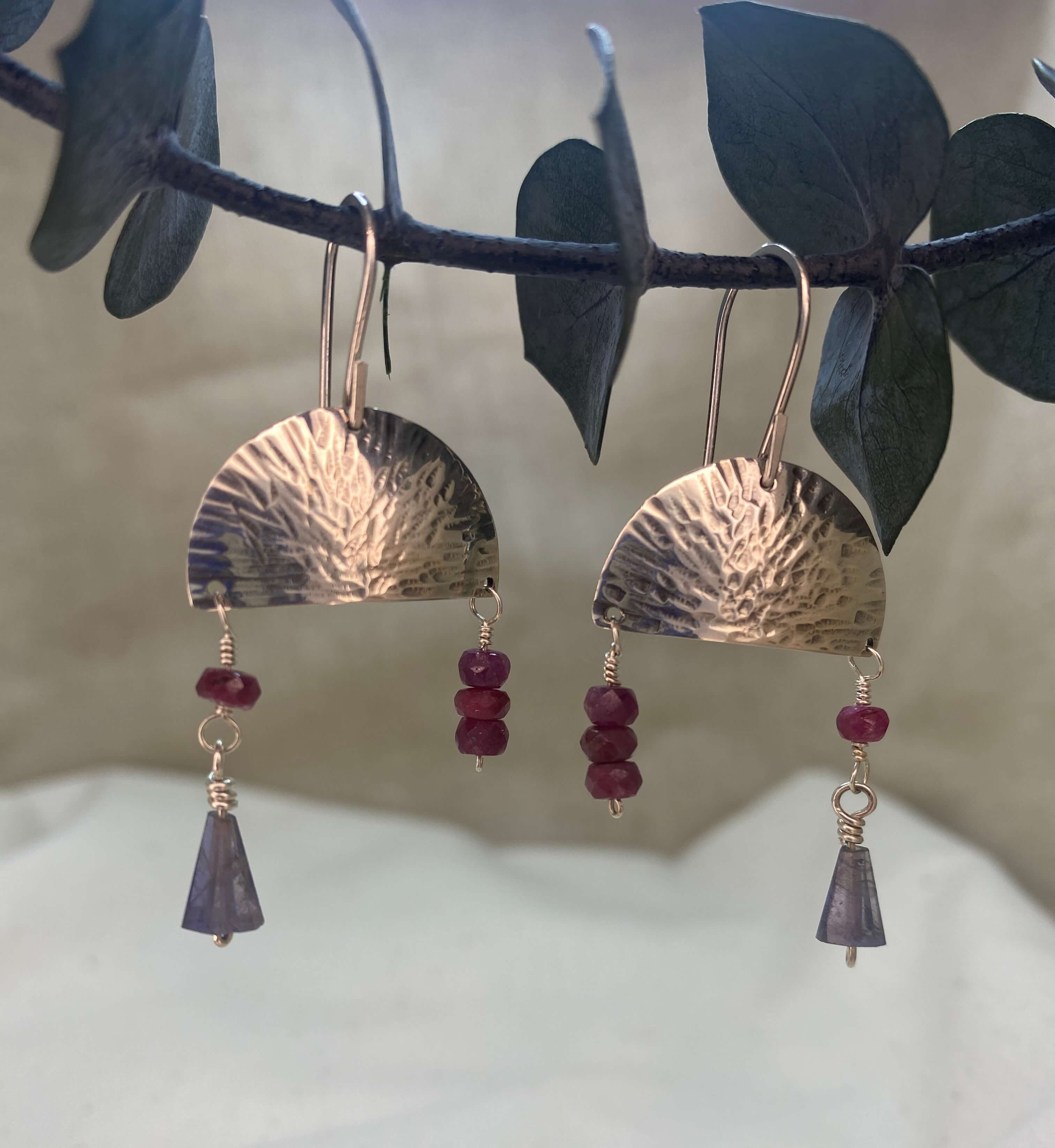 Hammered sterling silver half moon disc with ruby and iolite beads_front view