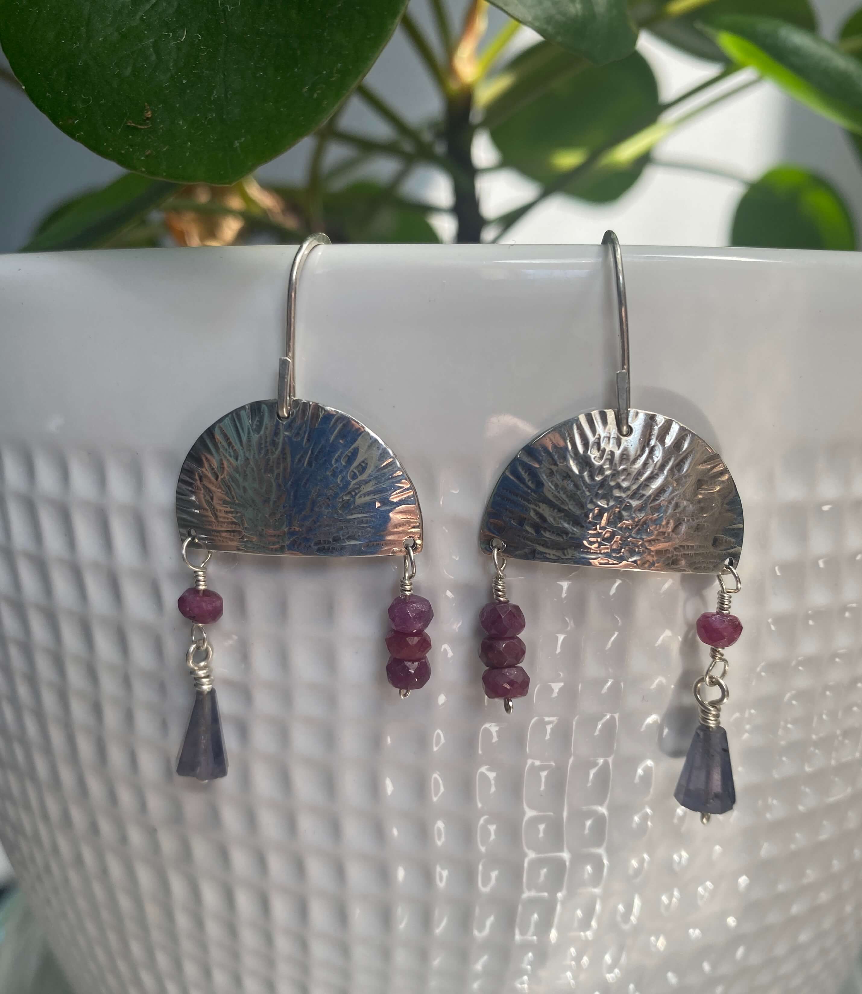 Hammered sterling silver half moon disc with ruby and iolite beads_front view