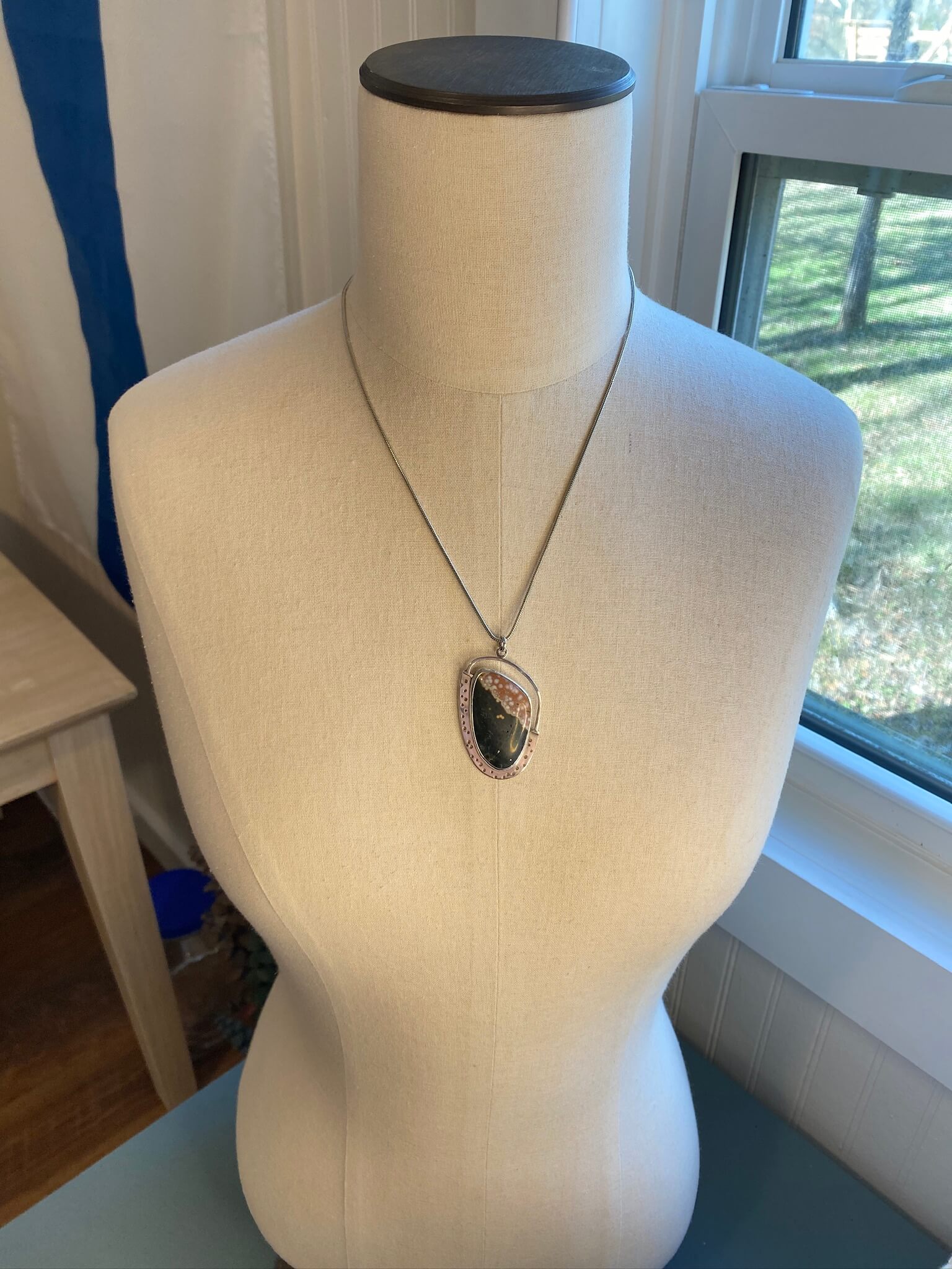 Ocean Jasper pendant in sterling silver - draped view