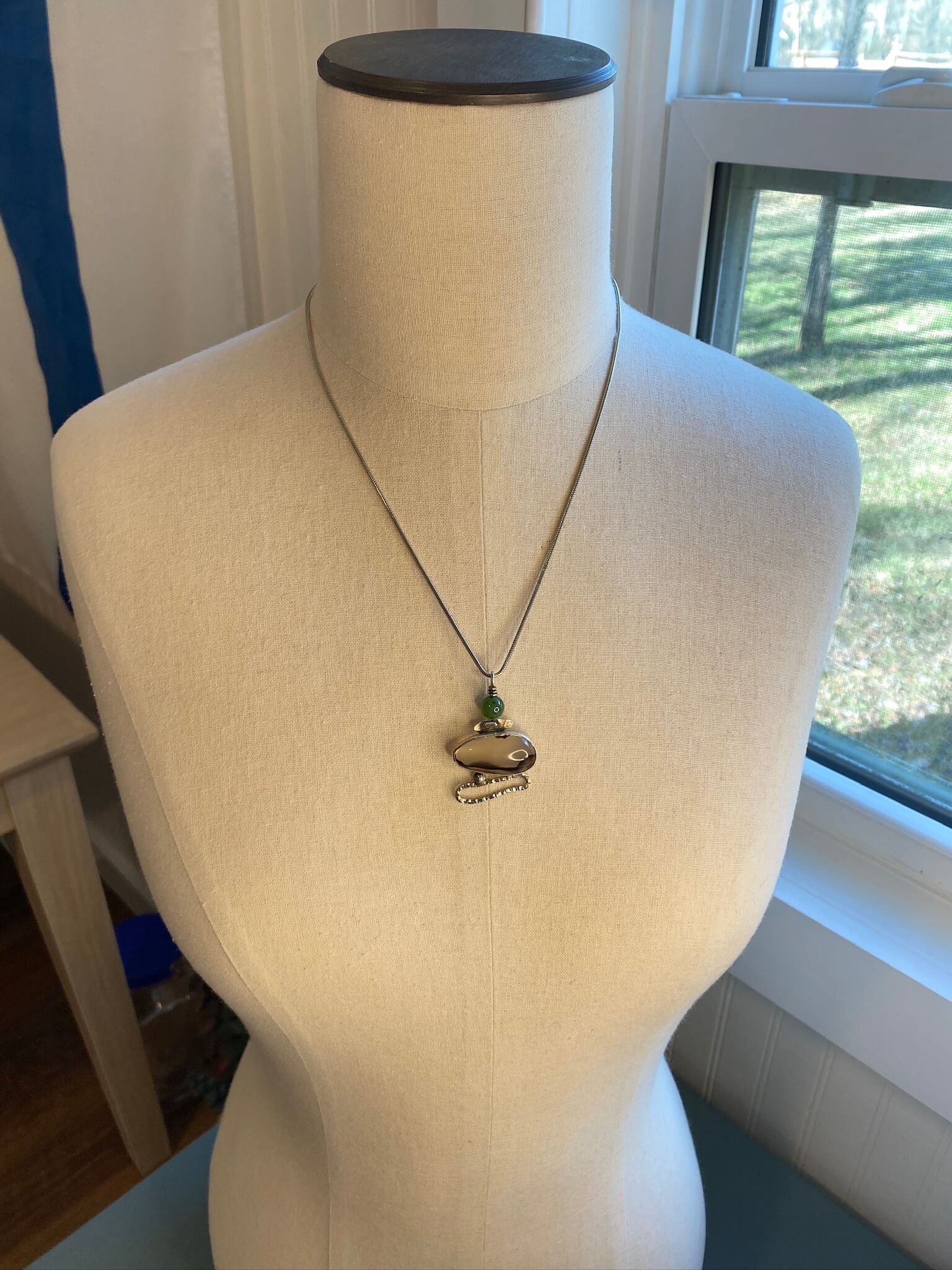 Pendant of Montana Agate, Jade and sterling silver - draped view