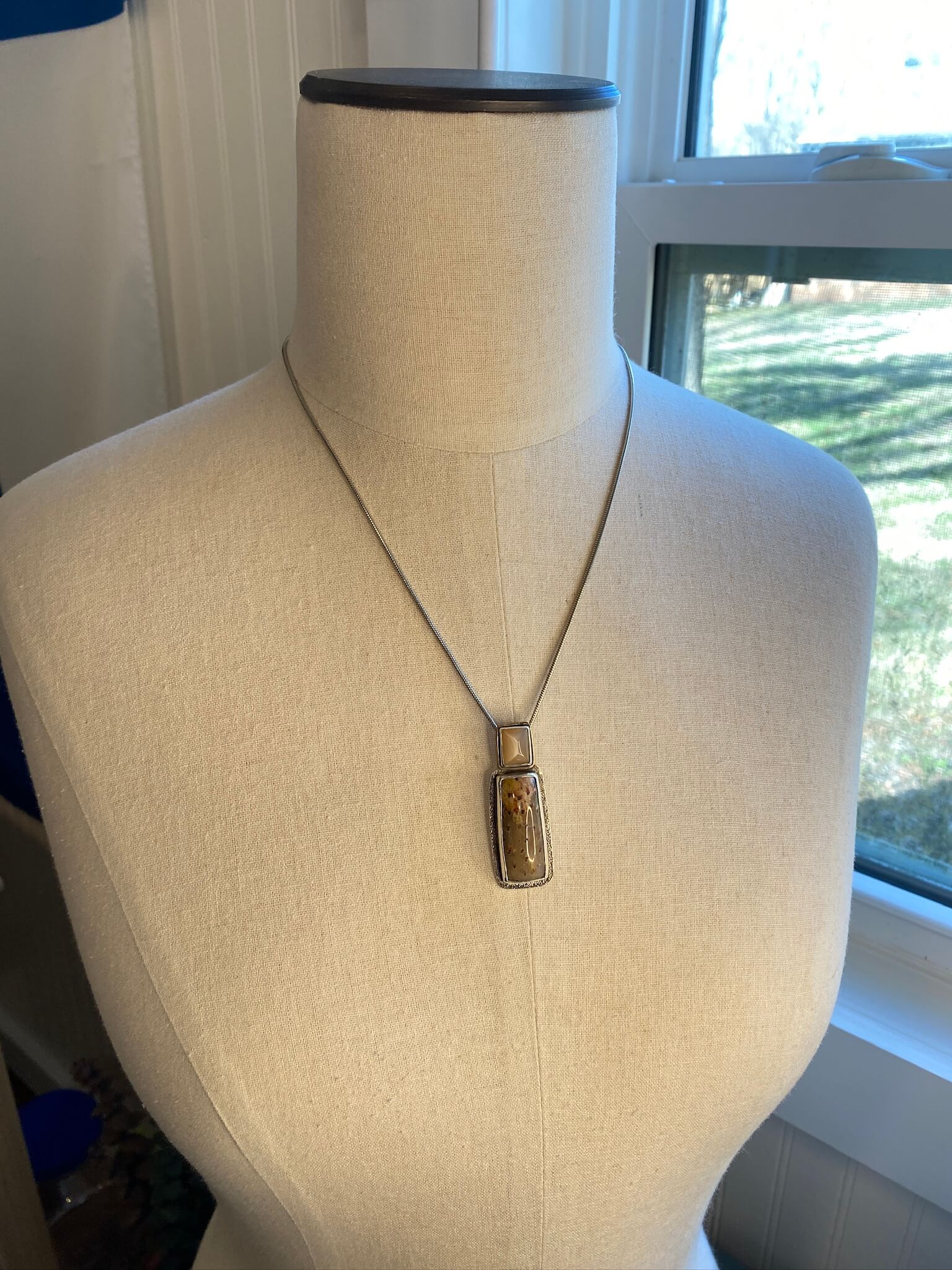 petrified palmwood orange moonstone pendant in sterling silver with gold filled accent - draped view
