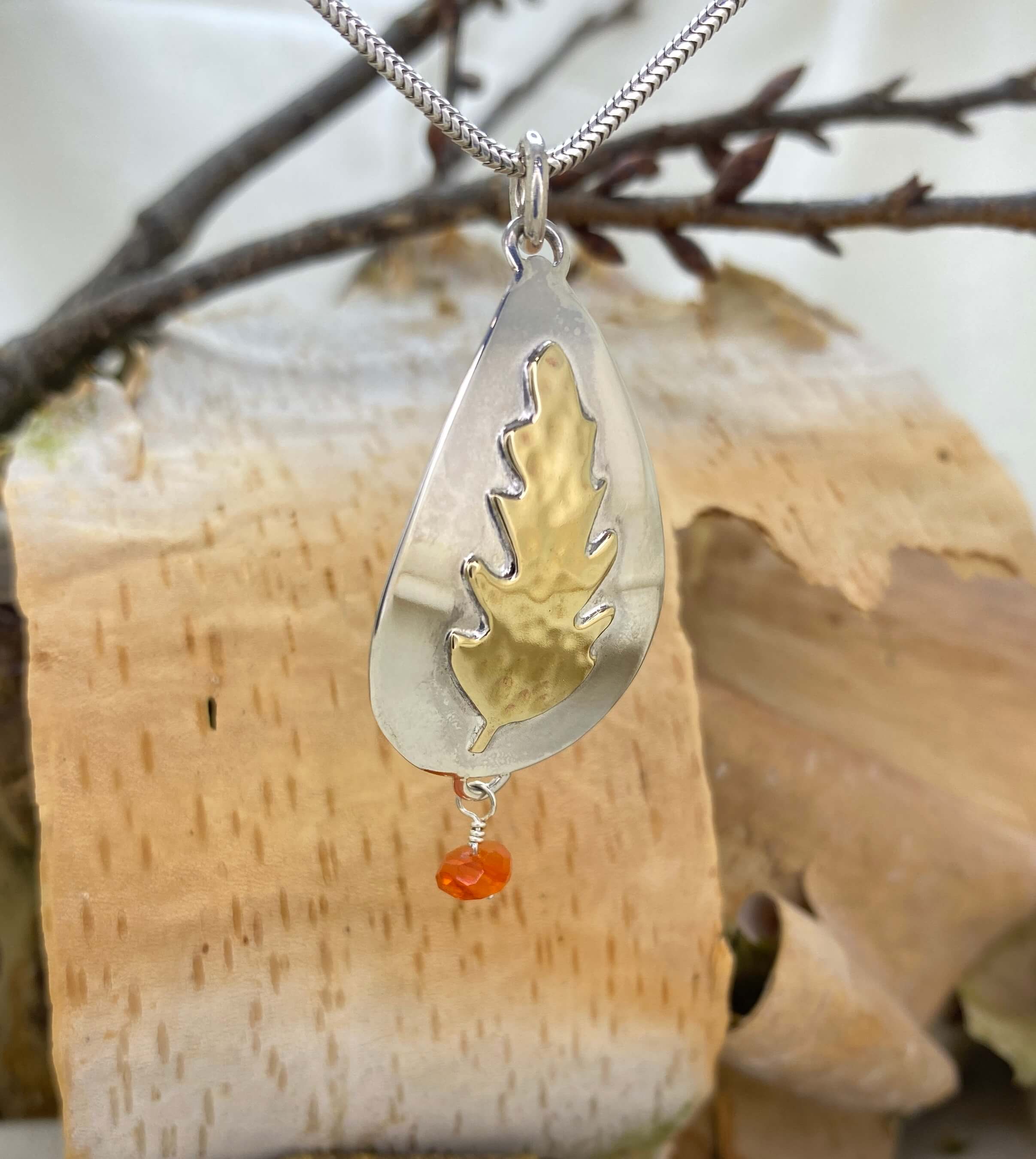 Dancing Flame and Leaf Charm angle view