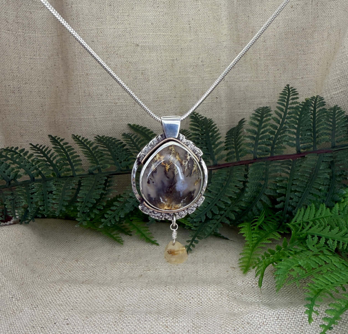 Oval Shaped Plume Agate Pendant in Silver_Front View