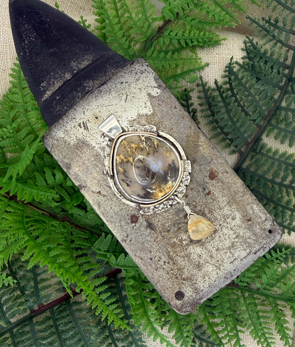 Oval Shaped Plume Agate Pendant in Silver_Overhead View