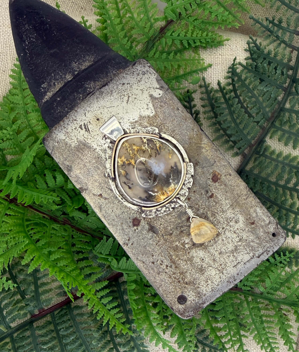Oval Shaped Plume Agate Pendant in Silver_Overhead View