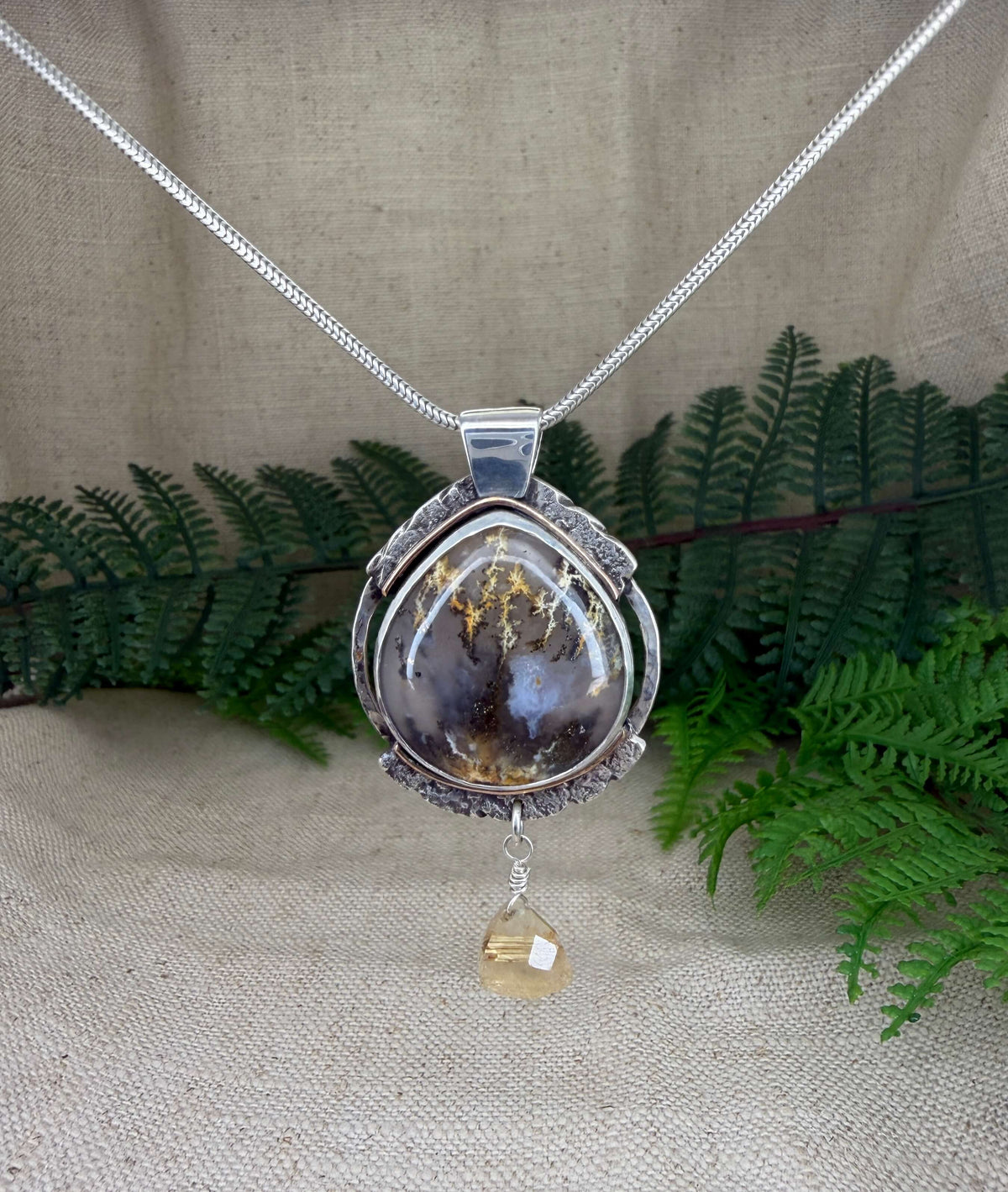 Oval Shaped Plume Agate Pendant in Silver_Front View