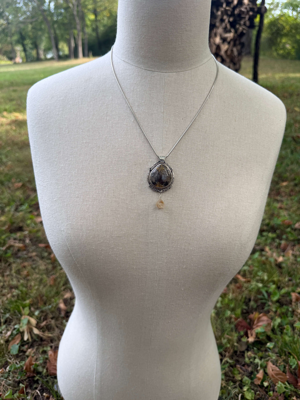 Oval Shaped Plume Agate Pendant in Silver_Dress Form View
