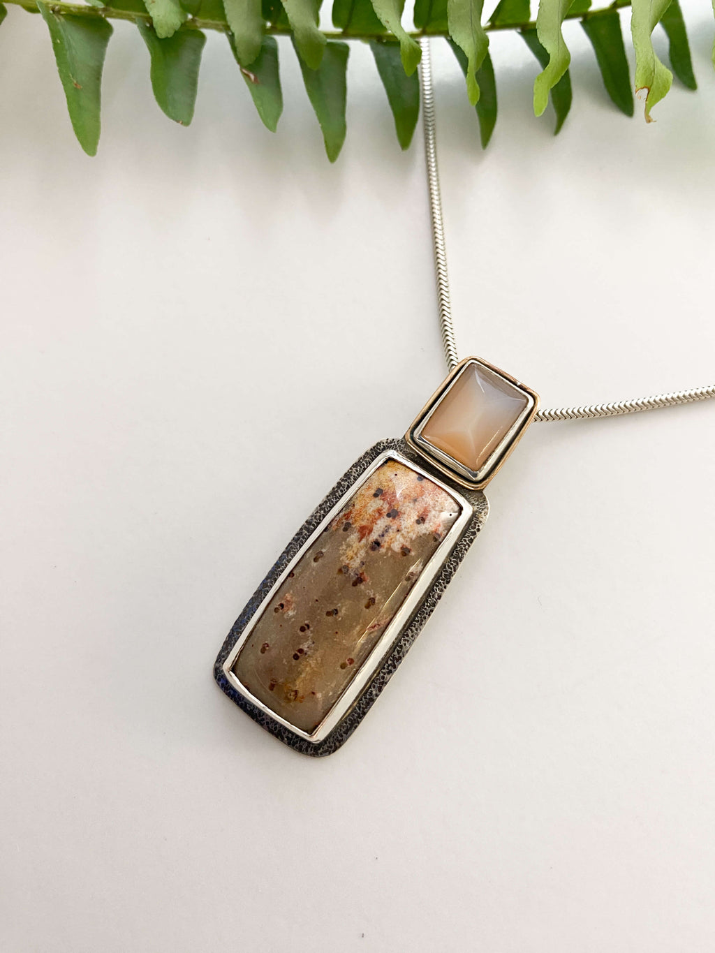petrified palmwood orange moonstone pendant in sterling silver with gold filled accent - left side view